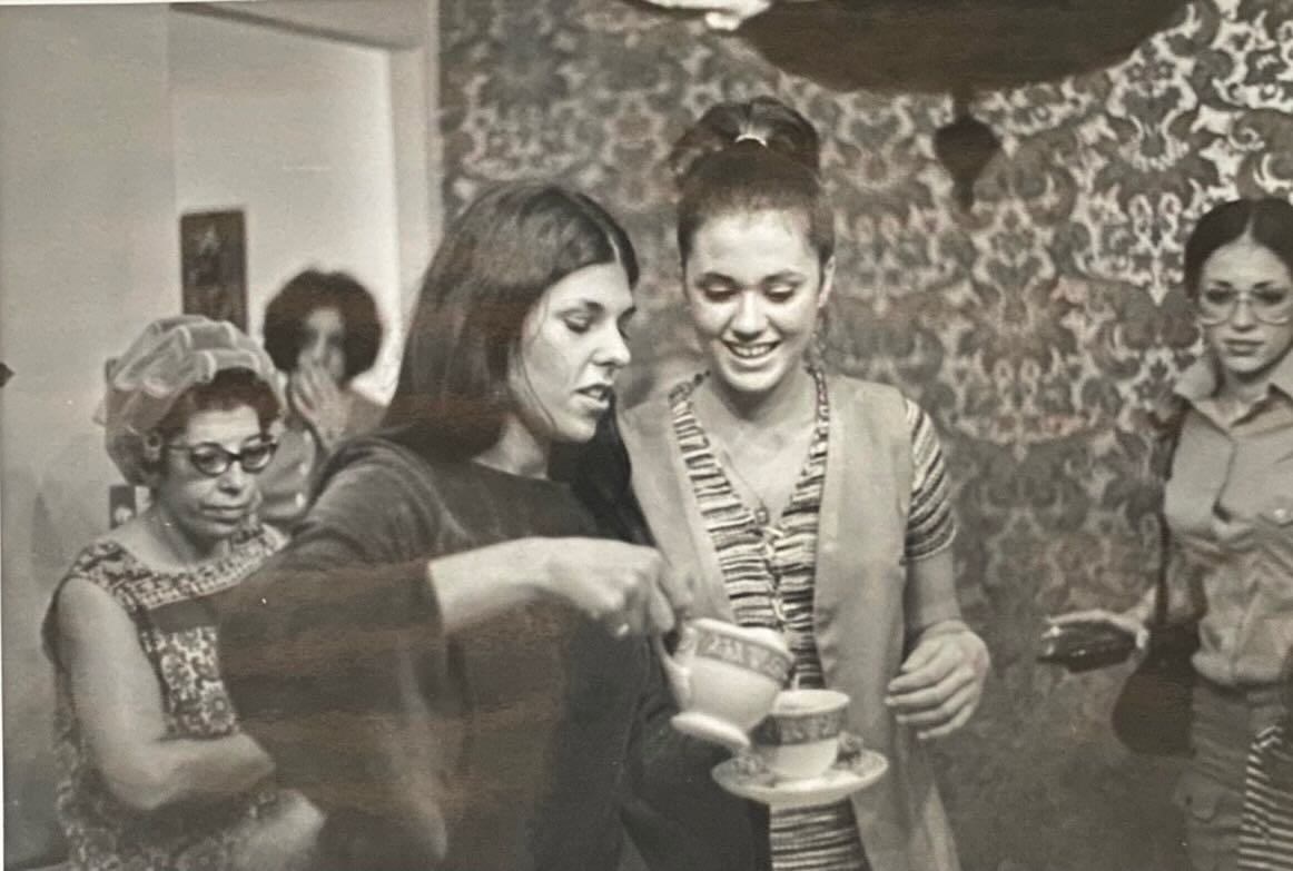 Lucy pouring tea